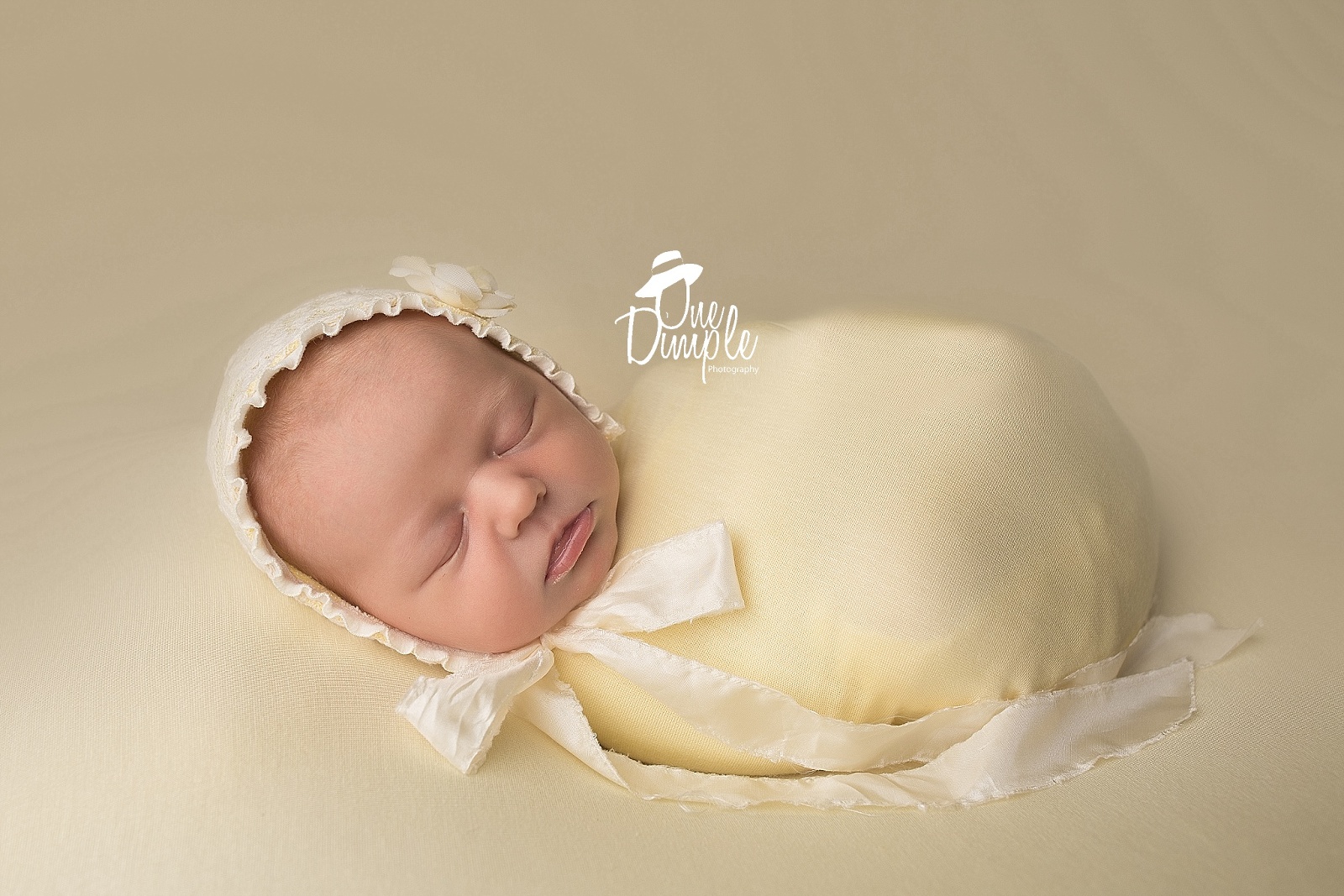 Newborn in yellow wrap