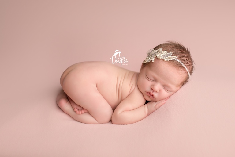One Dimple Photography is a DFW, Southlake, Trophy Club, Grapevine, Keller newborn photographer. In-Home Newborn Session in blush pink. 