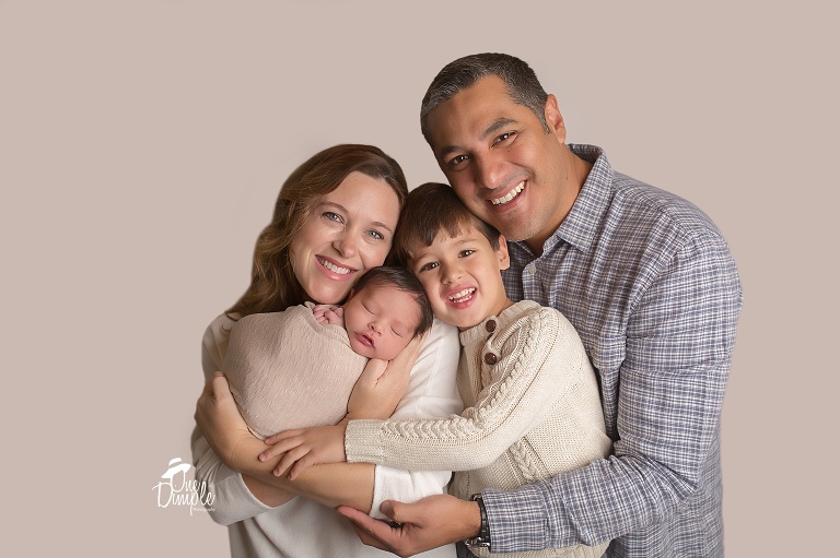  One Dimple Photography is a DFW, Southlake, Trophy Club, Grapevine, Keller newborn photographer. In-Home Newborn Session with neutral family photos
