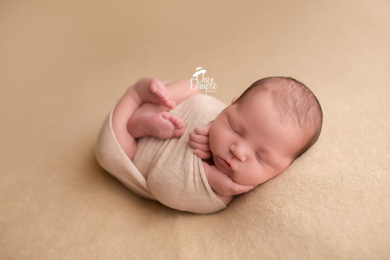 Dallas Newborn Photographer newborn in wrapped pose