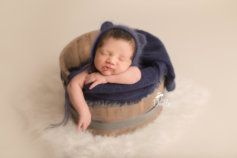 Trophy Club Newborn Photographer baby in bucket with bear hat