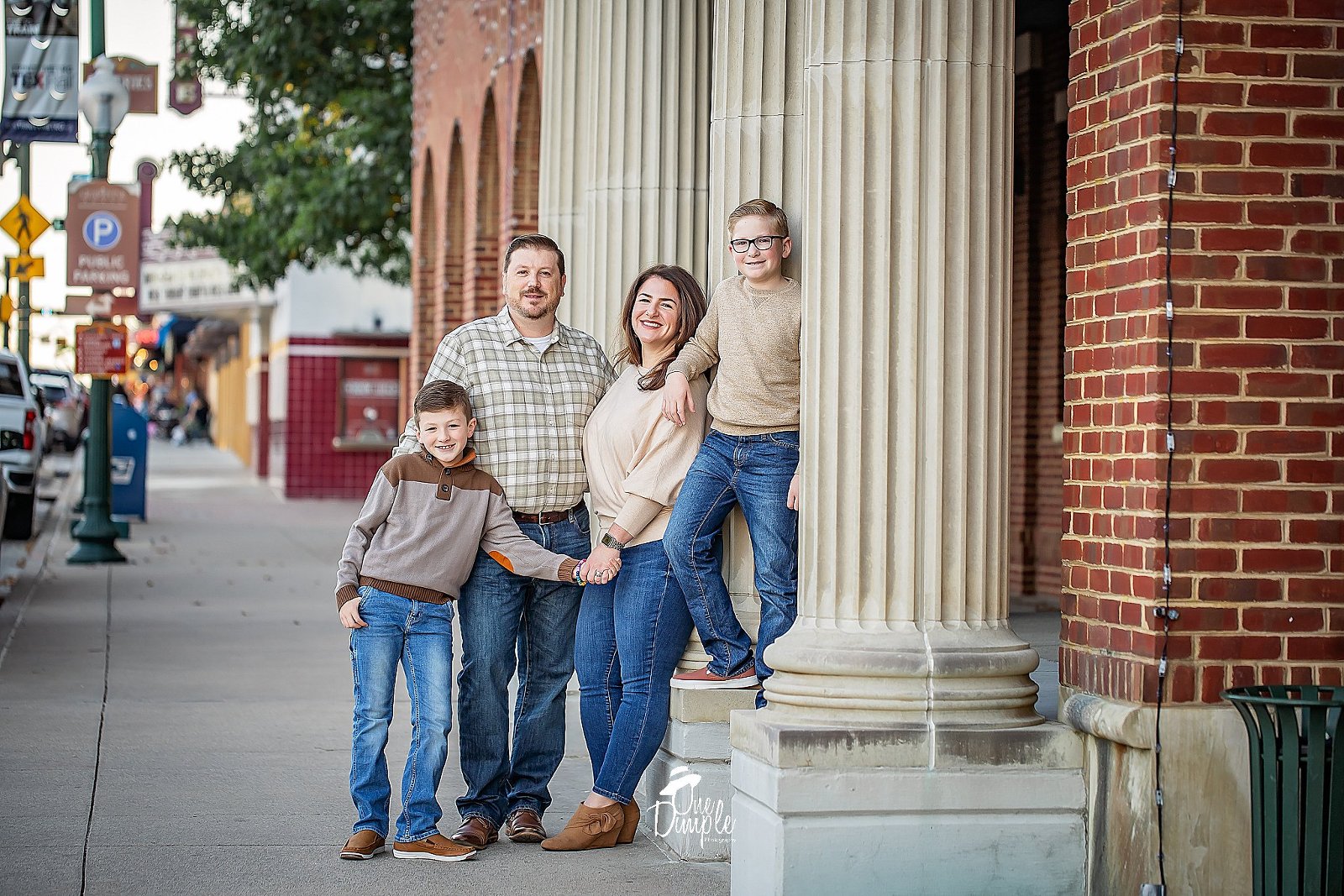 family posing in downtown grapevine